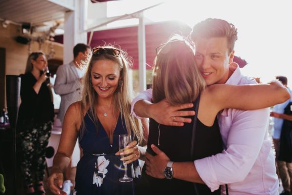 The groom hugs the arriving guests to the Get Together Party in Majorca.