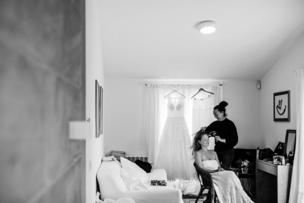 Hair drying of the bride in her room.