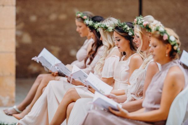 All bridesmaids sing a hymn in the church.